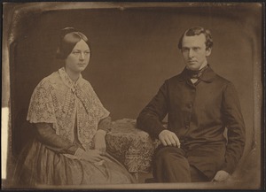 Young couple seated at table