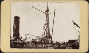 Soldiers in rigging and on deck of transport ship