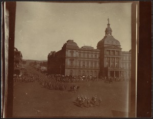 Soldiers in formation in city square near Council Chamber