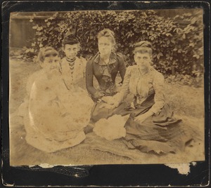 Four young women sitting on grass, Mary "Mollie" Stevens in dark dress