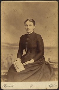 Helen Mead Granger Stevens (Mrs. Henry James Stevens) seated, holding book