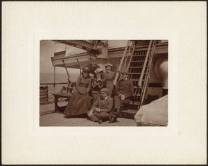Group of men and women on deck of ship
