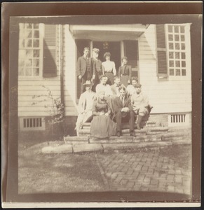 Coolidge family sitting on front steps of white house