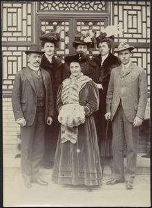 Group photo — John Gardner Coolidge (left) posing with 4 women, 2 men in front his house