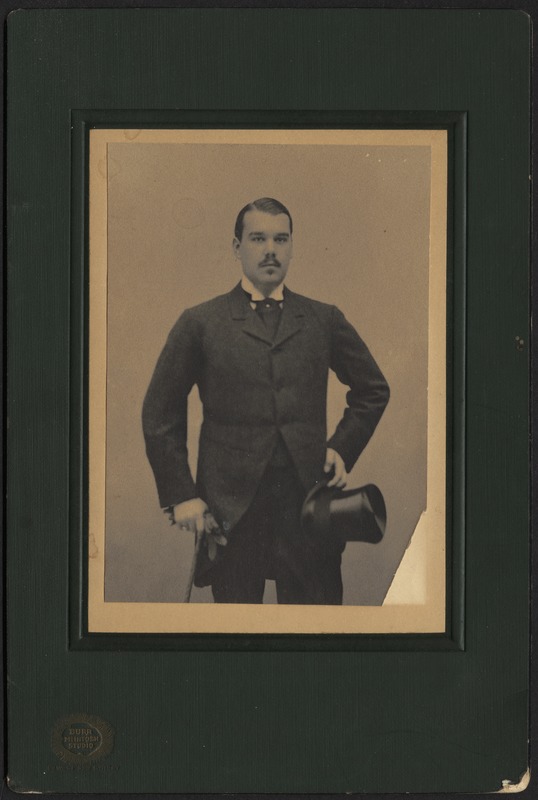Adelbert S. Hay standing with top hat and cane