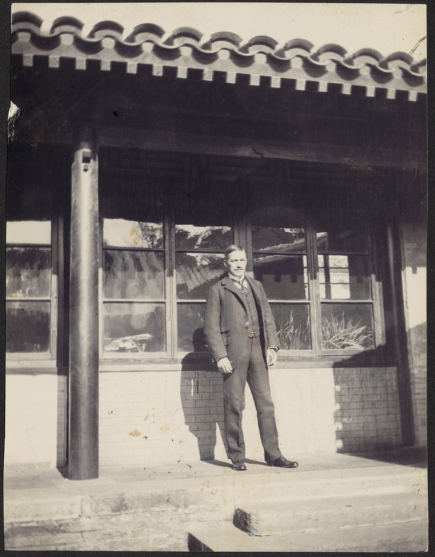 John Gardner Coolidge standing outside American Legation office, south side