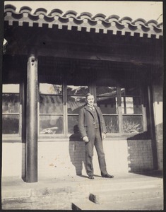 John Gardner Coolidge standing outside American Legation office, south side