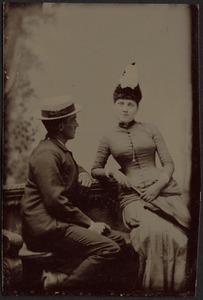 Joseph Randolph Coolidge Jr. seated on bench with young woman