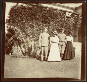 Adelbert S. Hay standing in garden with friends (two women and a cavalry officer)