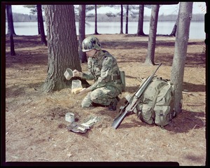 IO, G.I. eating long rations - preparing spaghetti