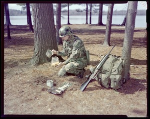 IO, G.I. eating long rations - preparing spaghetti