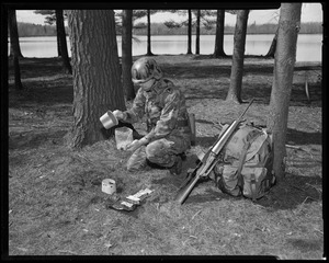 IO, G.I. eating long rations - preparing spaghetti