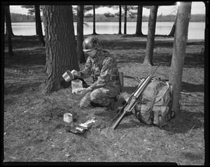 IO, G.I. eating long rations - preparing spaghetti