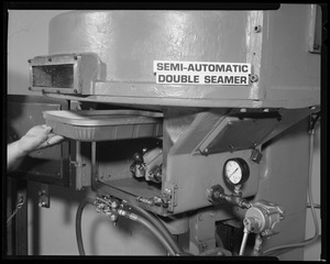 Food packaging div., semi-automatic double seamer with tray in place