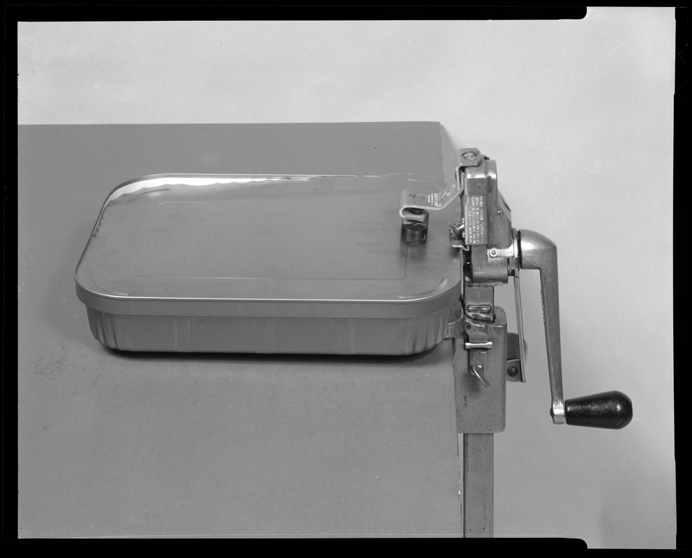 Food packaging div., institutional can opener with tray in place