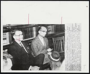 Arraigned on Spy Charges--Rudolf Ivanovich Abel, 55, said to be the highest ranking soviet agent ever arrested in the United States, waits for papers to be prepared today in U.S. Commissioner J.C. Hall's office here. At left is FBI Agent Clay Zachary of Brownsville. Abel signed a waiver removal and was expected to be returned to New York tomorrow.