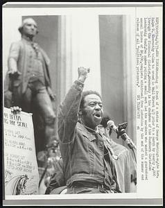 New York: Standing in front of a statue of George Washington, the Rev. Ralph D. Abernathy talks to crowd in Wall Street 4/5 prior to a march by nearly 4,000 through the financial district. Abernathy is the chairman of the Southern Christian Leadership Conf. Two mules pulling a small cart led the marchers who wanted a guaranteed annual income of $6,500 complete withdrawal from Indochina by the end of the summer and release of all "political prisoners."