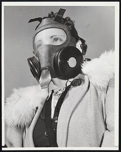 Bremerton Navy Yard Workers Get Gas Mask Practice. Some 13,500 civilian workers at the huge Navy Yard here on Puget Sound, this week started detailed instructions on the use of gas masks in preparation for possible gas attacks. This young woman is shown getting used to her mask at the yard during a recent drill. The workers walk through a small chamber filled with tear gas which shows them quickly if the mask is being worn correctly.