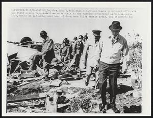 Larose, La.: Gov. John J. McKeithen (foreground) leads government officials and state agency representatives on a visit to the tornado-devastated Larose, La., area 10/5, during an air-and-ground tour of Hurricane Hilda damages areas.