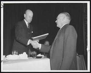 Charles Francis Adams, Jr., president of the Raytheon Manufacturing Co. of Waltham, receives the organization's 40th anniversary citation from Seabury Stanton, right president of associated Industries and chairman of the executive com-right, president of Associaway, Inc., New Bedford.