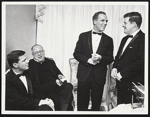 The Family-Mayor Kevin White, second from right, chats with left to right, Terrance, his brother; Rev. James Patrick, his uncle, and Brendan, his brother.