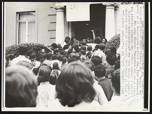 Students Takeover -- A group of protesting University of South Carolina students charge into the administration building during a protest today. The students occupied the first floor for sometime, causing what one spokesman said "was complete destruction of at least one office. The students later clashed with state troopers.