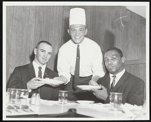 Fistic Servings -- Tom McNeeley acts as waiter for Don Fullmer (left) and Charley Scott at yesterday's boxing luncheon at the Beacon Lounge All three will take part in Friday night's all-star card at Boston Garden.