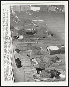 Some of those who apparently could not get home -- due to city's subway-bus strike-- bed down in a mid-town National Guard Armory here late 1/3. Michael J. Quill. TWU president, and 8 other union officials have been ordered to show cause early 1/4 why they should not be jailed for contempt in disobeying a state Supreme Court injunction against the strike action.