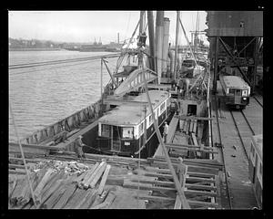 Railroad car being hoisted