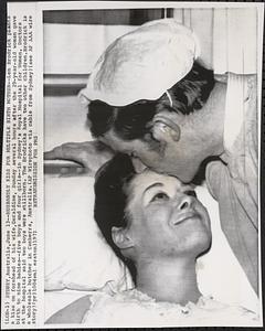 Husbandly kiss for multiple birth mother