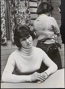 Rosalie McCusick with prison guard in background