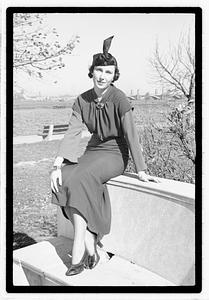 A model posing by the Oliver Wendall Holmes Memorial Sundial