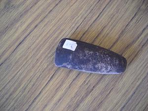 Stone tool on wood surface