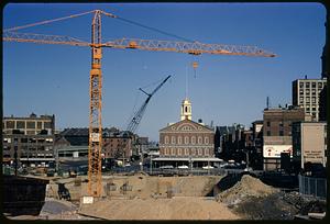 Construction site for Boston City Hall with Faneuil Hall in background