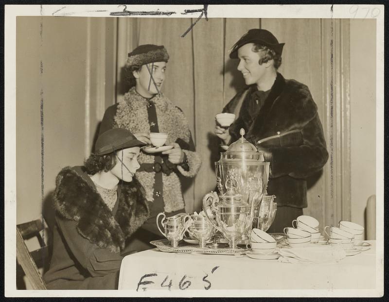 Three of Vincent’s newest members snapped at the club’s recent tea to honor its new recruits--Miss Abigail Adams (pensively looking at the silver), Miss Anne Reed Gallagher (in the krimmer-trimmed costume) and Miss Florence Hoar Bowditch. All three of them are debutantes. Miss Adams is the daughter of Mr. and Mrs. John Adams of South Lincoln; Miss Gallagher was presented early in the season at a luncheon given by her mother, Mrs. Rollin M. Gallagher of Milton, at their summer place in Fitzwilliam, N. H., and Miss Bowditch made her debut last month at a dance given by her parents, Mr. and Mrs. John P. Bowditch of Concord.