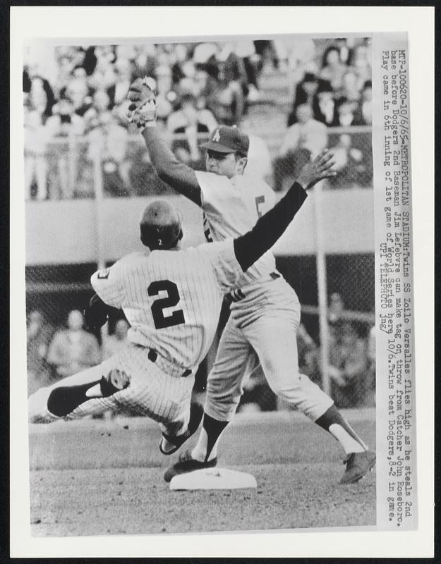 Metropolitan Stadium Twins SS Zoilo Versalles flies high as he steals