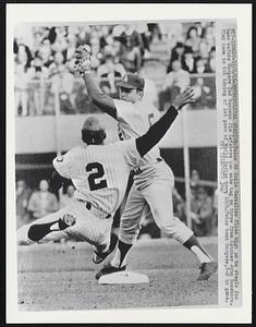 Metropolitan Stadium: Twins SS Zoilo Versalles flies high as he steals 2nd base before Dodgers 2nd Baseman Jim Lefebvre can make tag on throw from Catcher John Roseboro. Play came in 6th inning of 1st game of World Series here 10/6. Twins beat Dodgers, 8-2 in game.