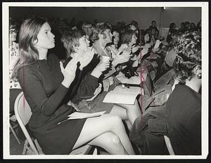 Boston teachers register support of strike at a rally in Florian Hall, Dorchester.