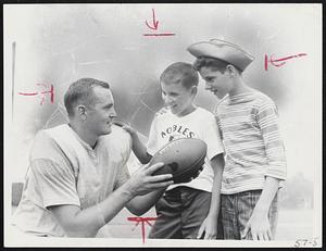 Camp Visitors Billy Sullivan, Jr., (center), son of the Boston Patriots' president, and Charles Dubois of Chicopee, chat with Pats' Geri Schwedes during break in practice session at Amherst.