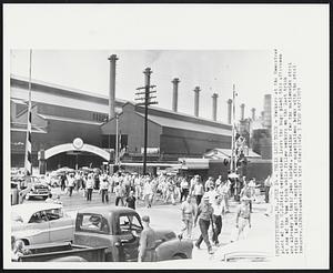 Their Last Trick - Workers at the Homestead plant of the U.S. Steel corporation leave the huge plant this afternoon at end of the 4pm trick while fellow workers on the last trick are already at their jobs inside. Deadline for the nationwide steel strike is midnight tonight after negotiations broke with the steel industry.