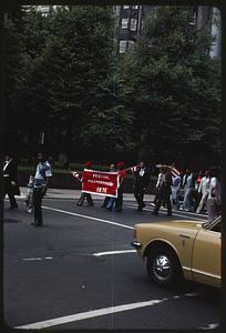 People holding Festival Puertorriqueño 1976 sign