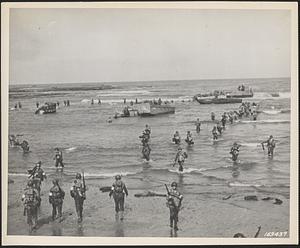 U.S. troops landing with Higgins assault boats on a beach in French Morocco