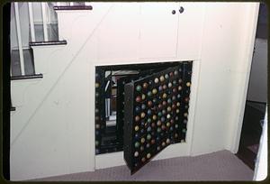 Storage space with decorative door under the stairs of a home on the bicentennial house tour