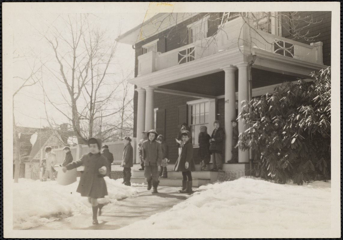 Children at play in front of 147 Prince Street school