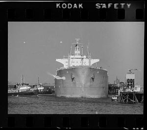 Tugs guide tanker to pier, Northern Avenue, Boston