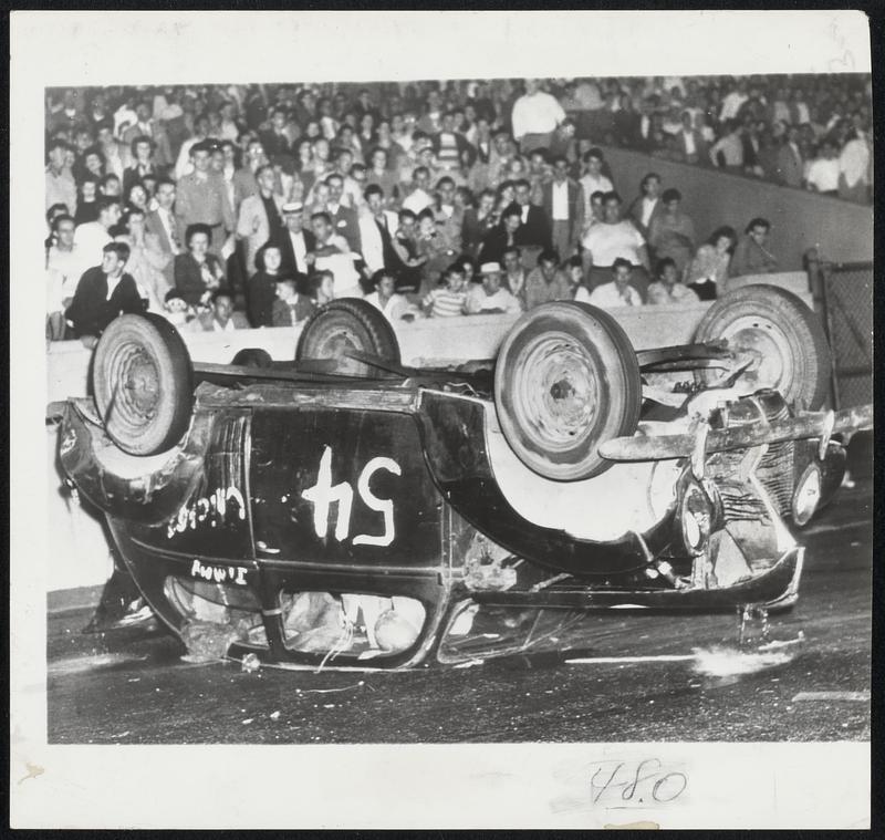 Crack-Up in Stock Car Race-Bud Richardson, whose helmeted head is ...