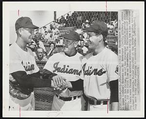 Old Rivals Now Teammates--Manager Al Lopez (center) watches as Hal Newhouser (left), pitcher, shakes hands with Bob Feller, one of the Cleveland Indians big-four pitchers, for the first time as teammates. The Feller-Newhouser pitching feuds were famous in sporting circles during the time Newhouser pitched for Detroit. Feller reported at the Tribe's spring training camp here today after agreeing to contract terms.