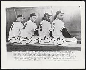 Milwaukee – This Is The Year Milwaukee Goes Major League – Theri new home uniforms, with blue caps, red visors, and M for Milwaukee help spell out the year 1953 as the Milwaukee Braves make their first visit to the new stadium which will be their home this year after transfer from Boston. Left to right: Catcher Del Crandall, First Baseman Joe Adcock, Center-fielder Sam Jethroe, and Utility Outfielder Jim Pendleton.