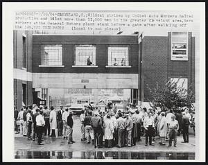 Cleveland, O.: Wildcat strikes by United Auto Workers halted production and idled more than 11,000 men in the greater Cleveland area. Here workers at the General Motors plant stand before a gate after walking off the job.