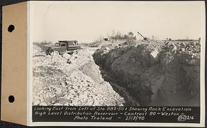 Contract No. 80, High Level Distribution Reservoir, Weston, looking east from left of Sta. 889+50+/- showing rock excavation, high level distribution reservoir, Weston, Mass., Feb. 13, 1940